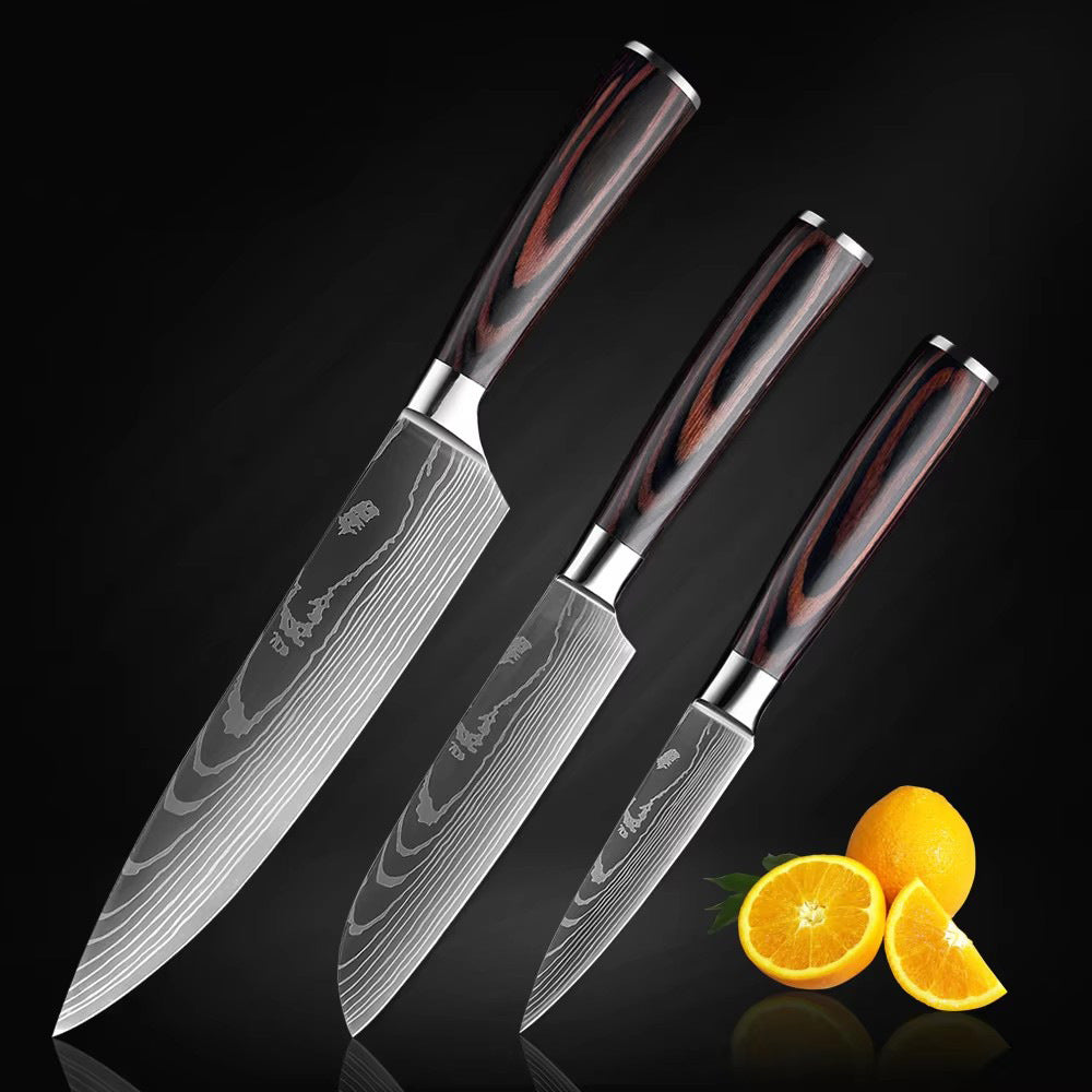The Domestic Artifact steel kitchen knife set with wooden handles, featuring multiple knives on a wooden cutting board.