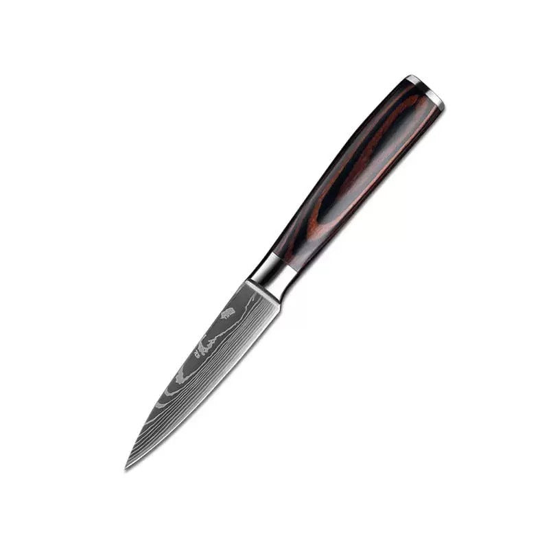 Set of six steel kitchen knives with wood handles from The Domestic Artifact, displayed on a wooden cutting board.