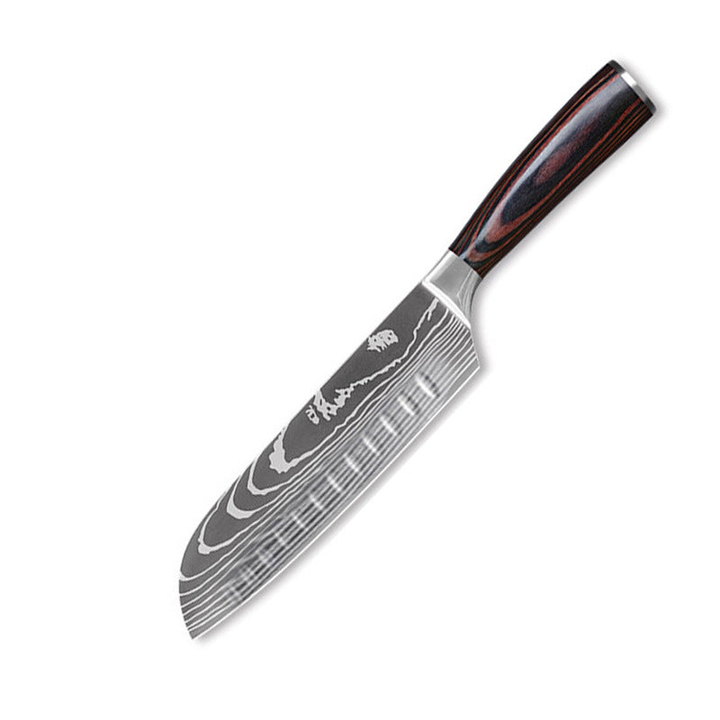 The Domestic Artifact steel kitchen knife set with wood handles, featuring multiple knives arranged on a countertop.